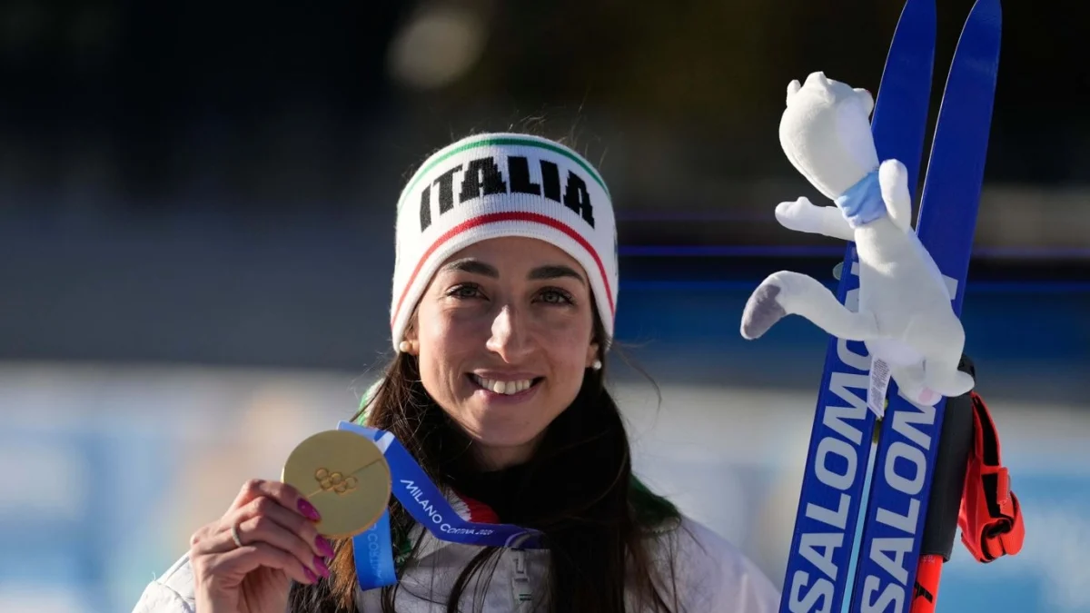 Il riscatto di Lisa Vittozzi, prima medaglia d'oro nel biathlon: l'infanzia con i nonni, la crisi per i dolori alla schiena — corriere.it