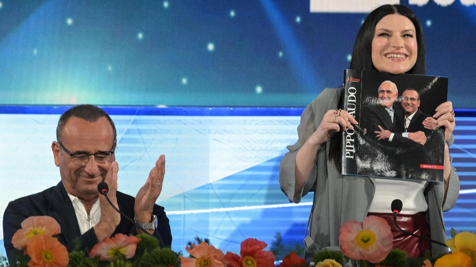 Sanremo 2026: primeira conferência com Carlo Conti e Laura Pausini e a entrada surpresa de Fiorello